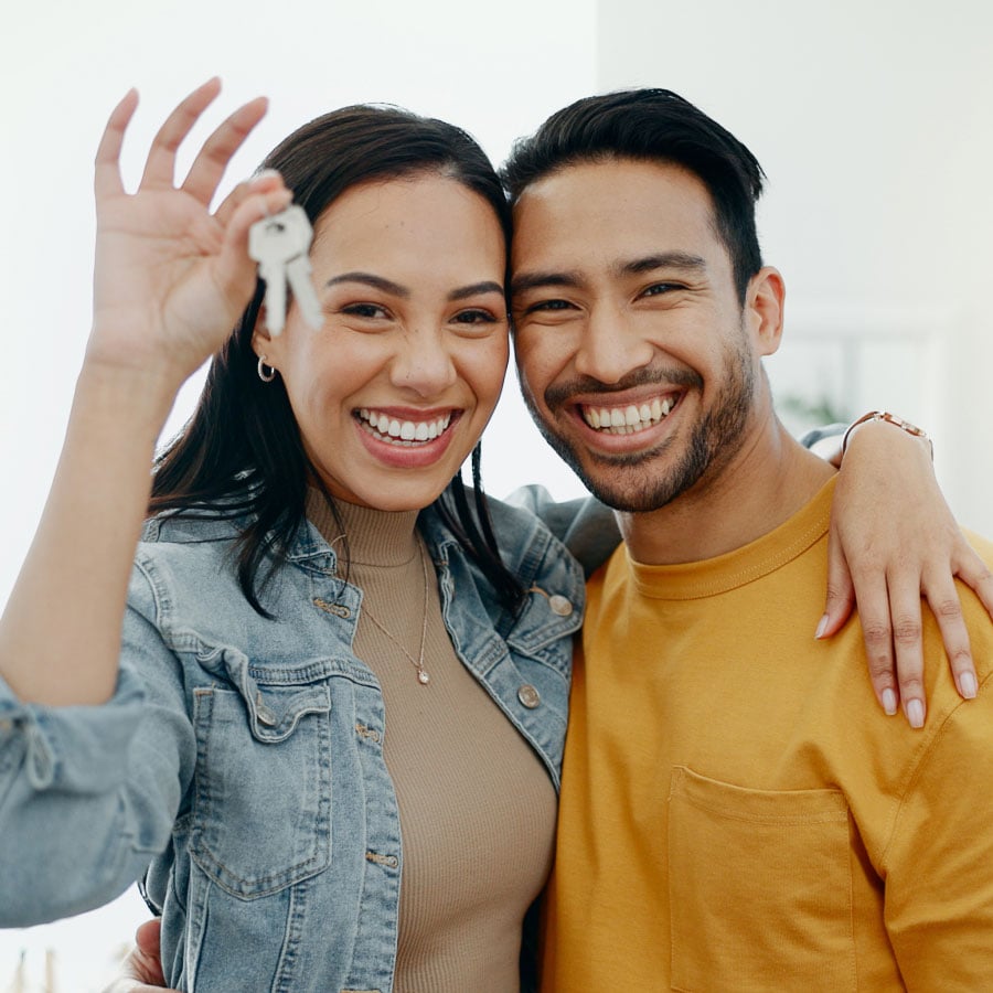 smiling-couple-moving-into-new-home smiling-couple-moving-into-new-home